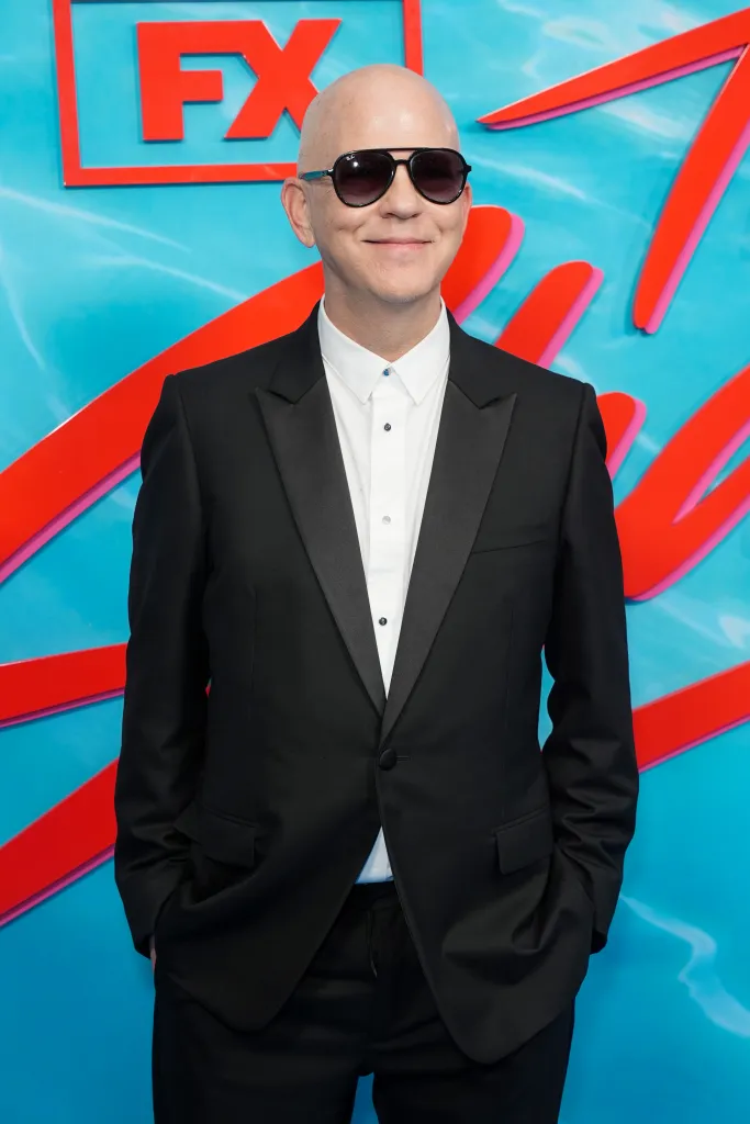 Ryan Murphy wearing sunglasses and a black tuxedo jacket with an open white shirt at "The Shards" World Premiere.