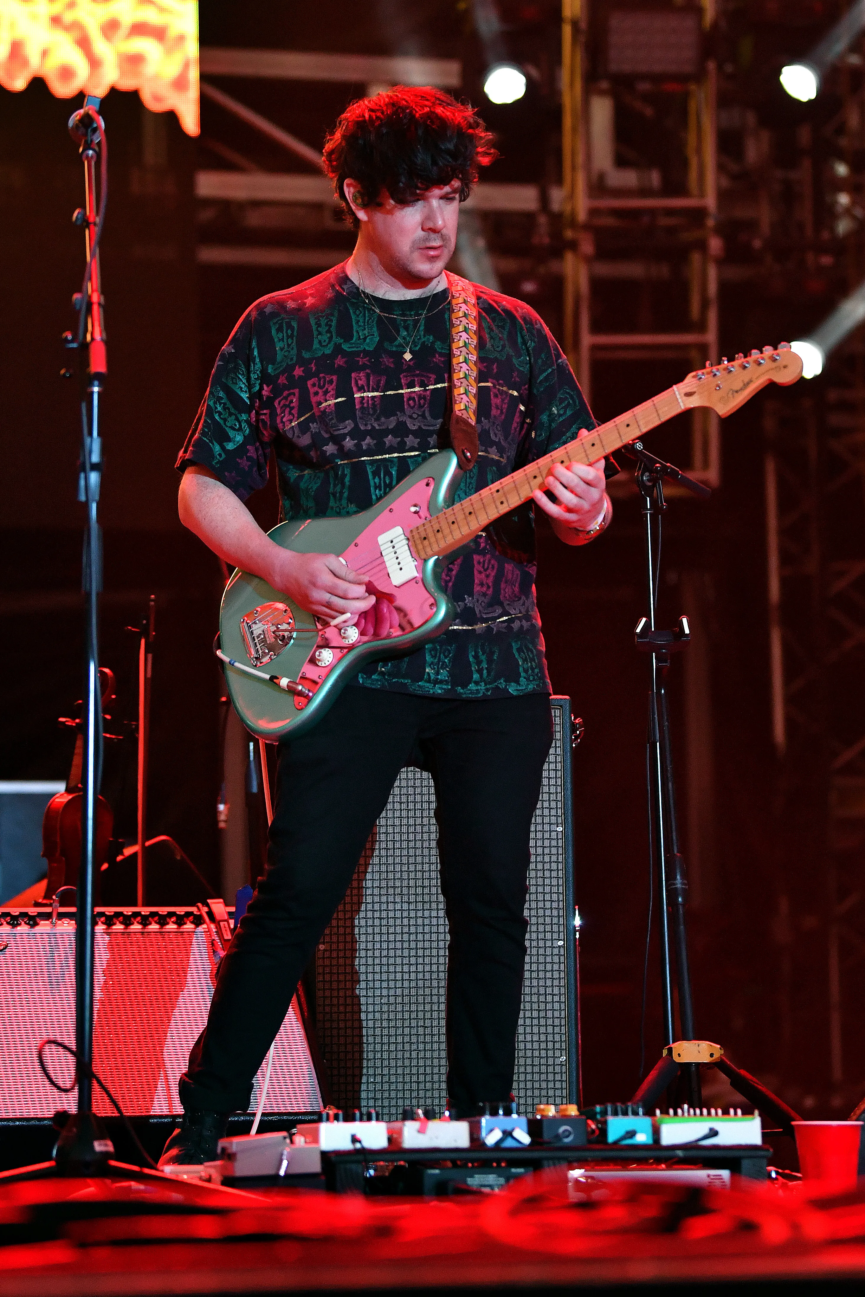 Simon O'Connor performing with a guitar at the Audacy Beach Festival.