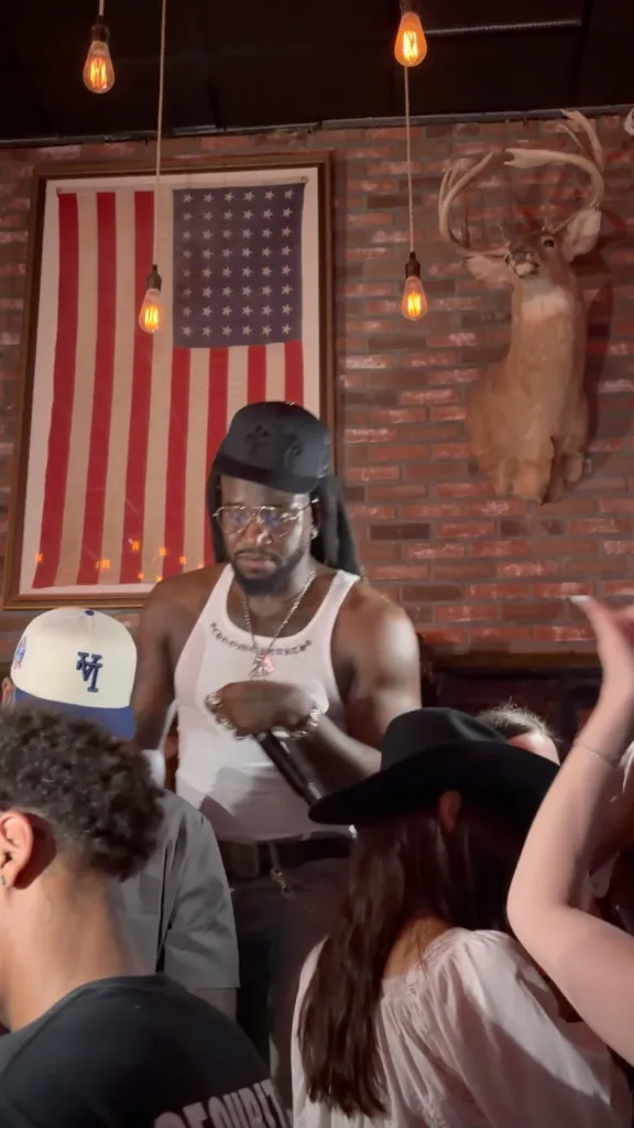 Shaboozey performing at his album release party.
