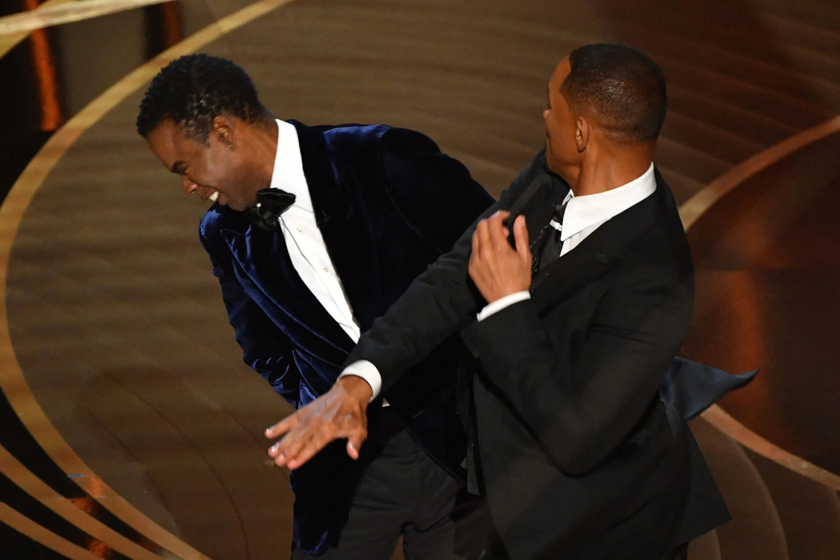 Will Smith slaps Chris Rock on stage.