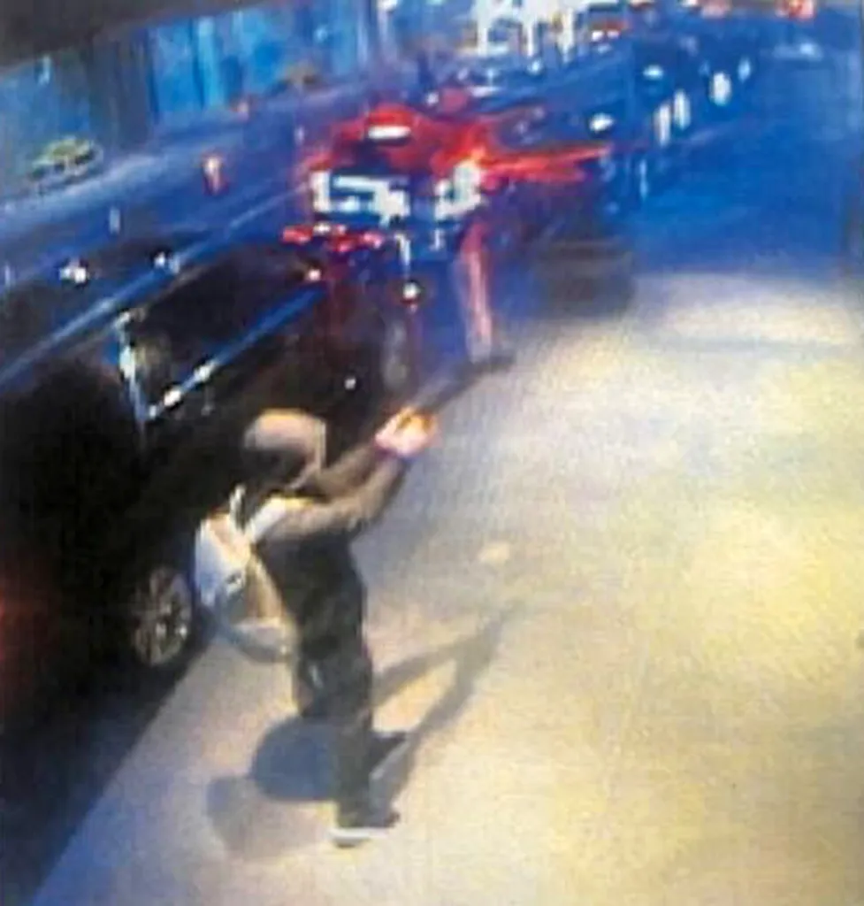 Surveillance footage of Luigi Mangione, a person of interest in a murder, outside the Midtown Hilton Hotel.