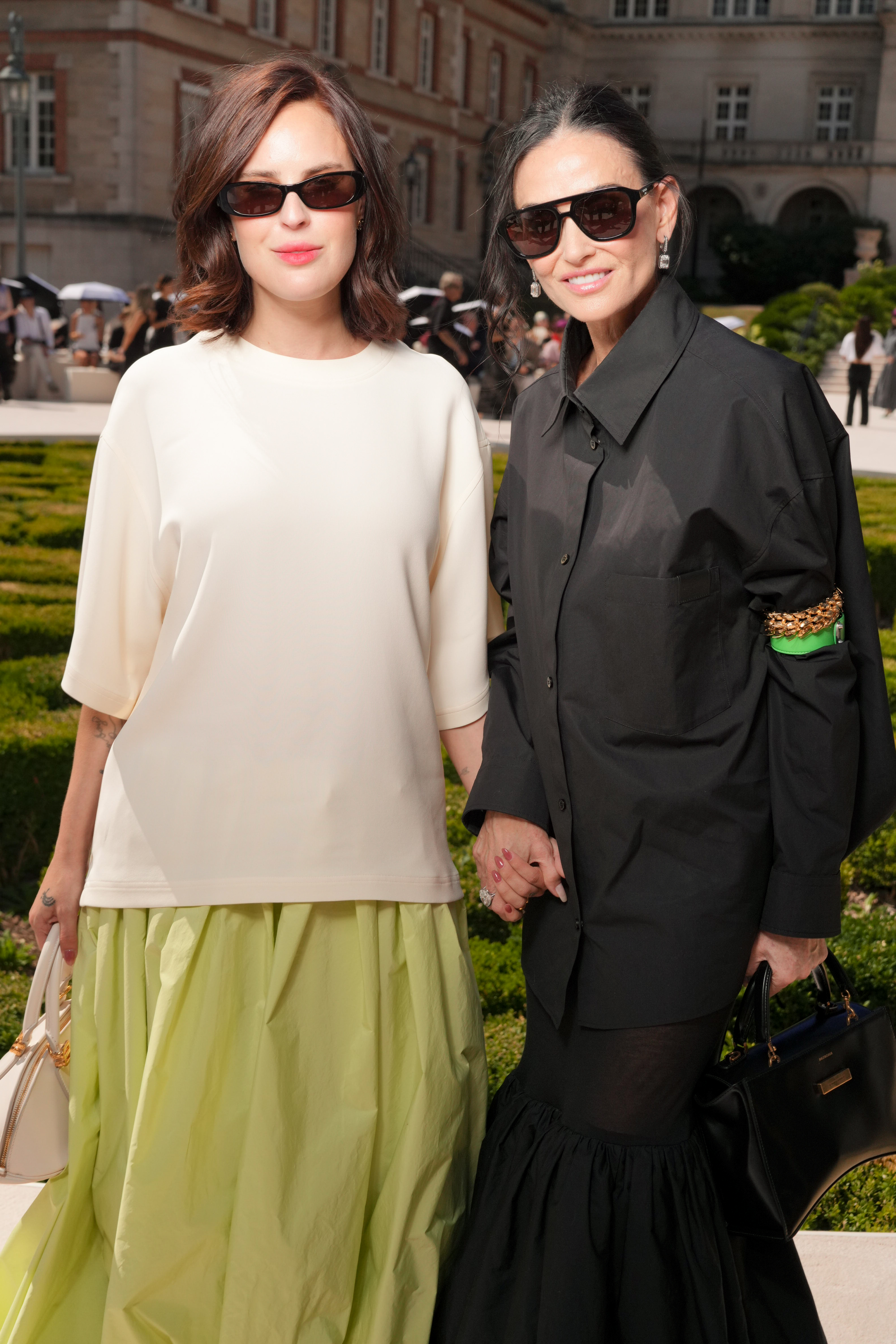Tallulah Willis and Demi Moore holding hands at the Balenciaga Fall/Winter 2026 fashion show.