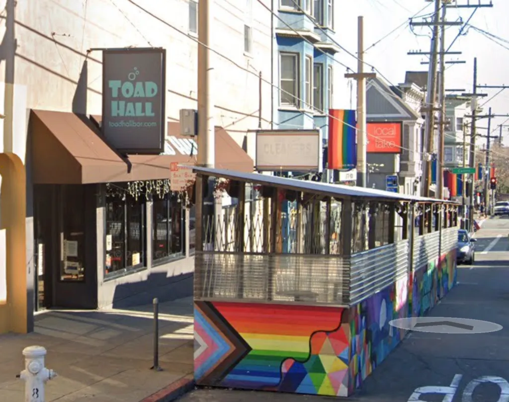 Toad Hall bar with a brightly painted outdoor seating structure, San Francisco, California.