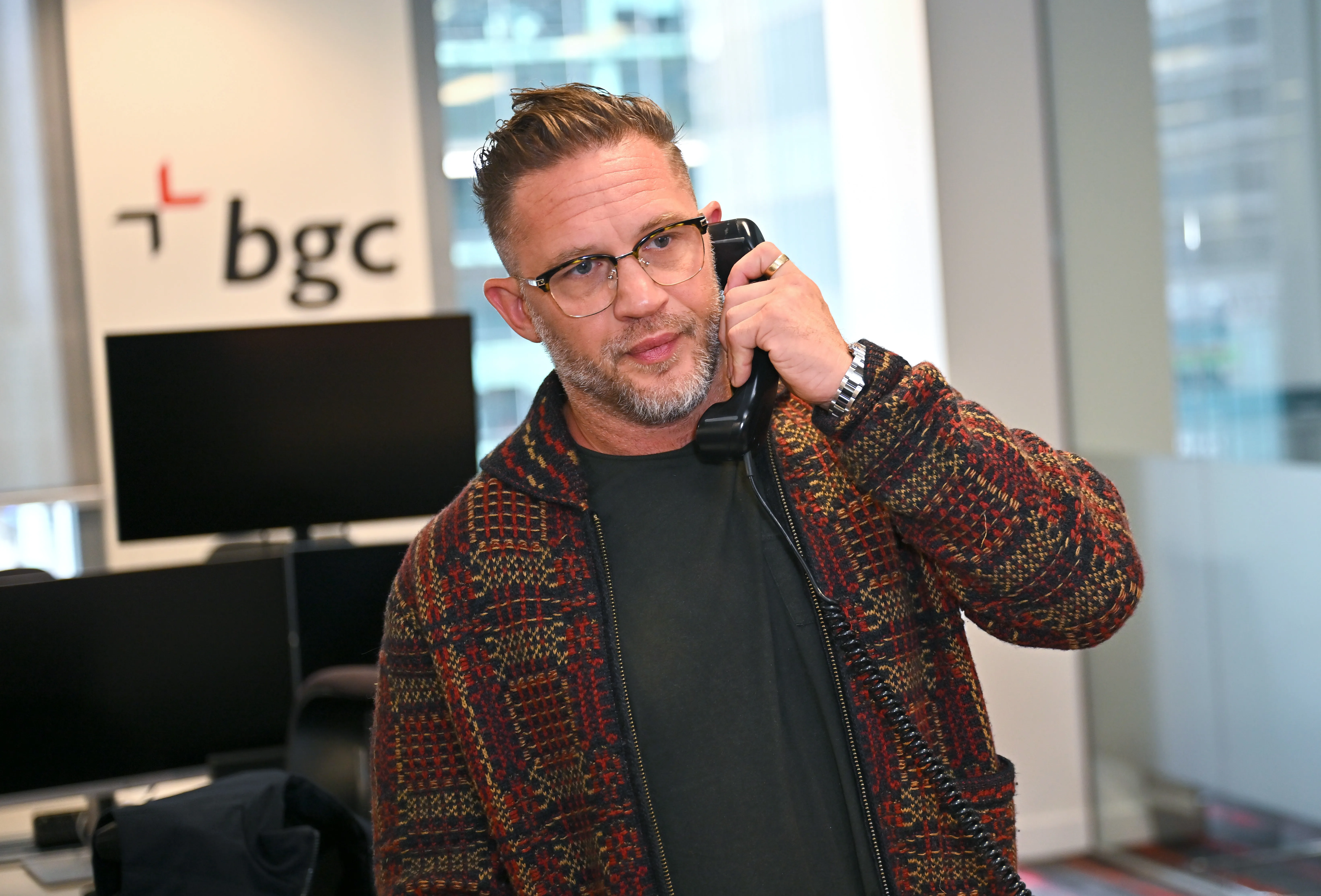 Tom Hardy on the phone at the BGC Group Charity Day.