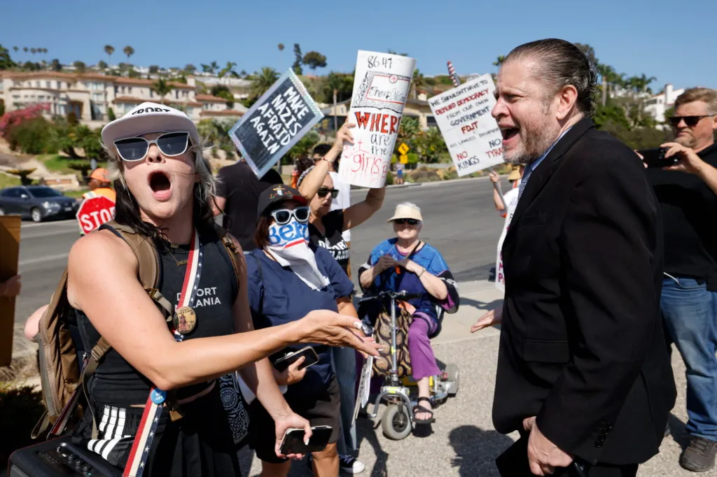 Trump supporters clash with protesters outside Trump National Golf Club.