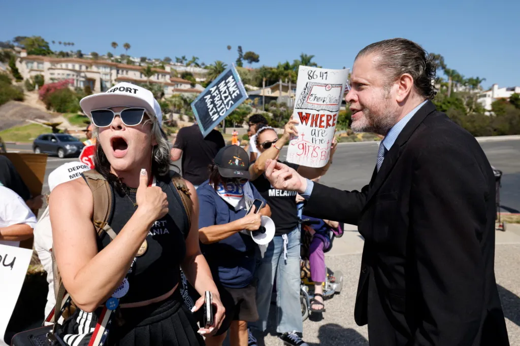 Trump supporters clash with protesters outside Trump National Golf Club.