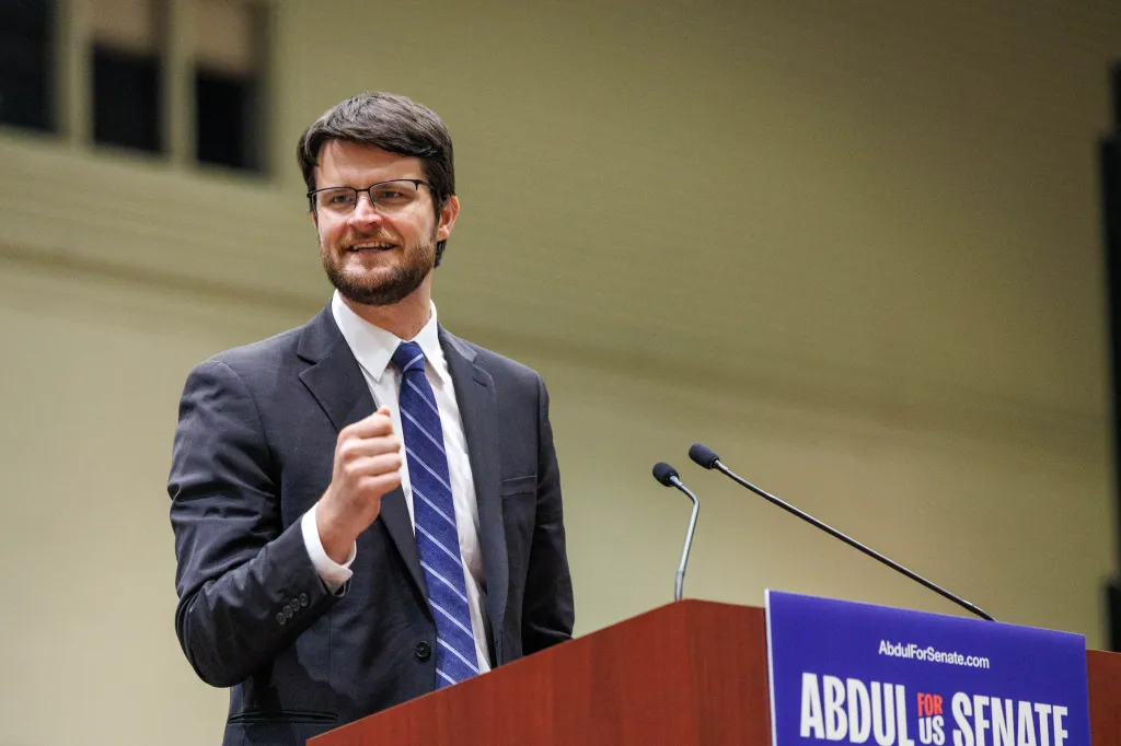 William Lawrence speaks at a rally with Abdul El-Sayed, Bernie Sanders and Alexandria Ocasio-Cortez.