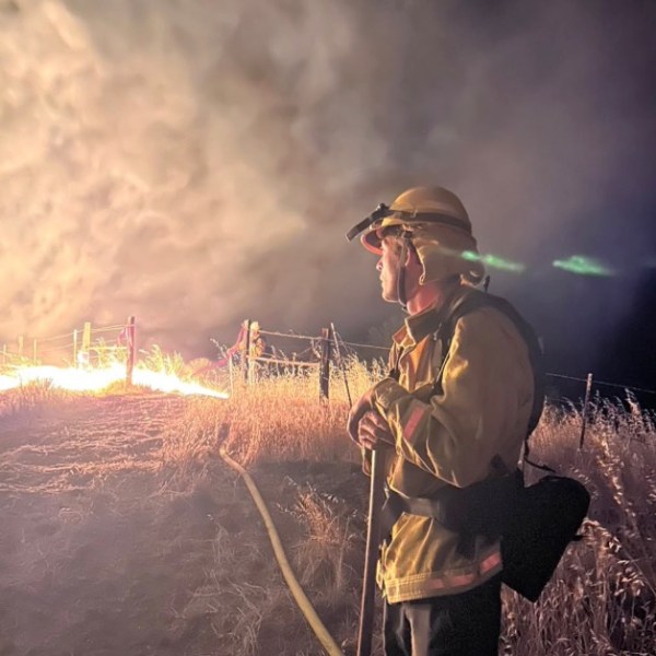 Firefighter fighting a timber fire in Big Sur.