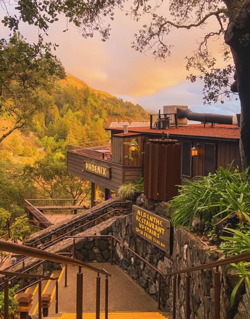 Exterior of Nepenthe Big Sur restaurant in the mountains.