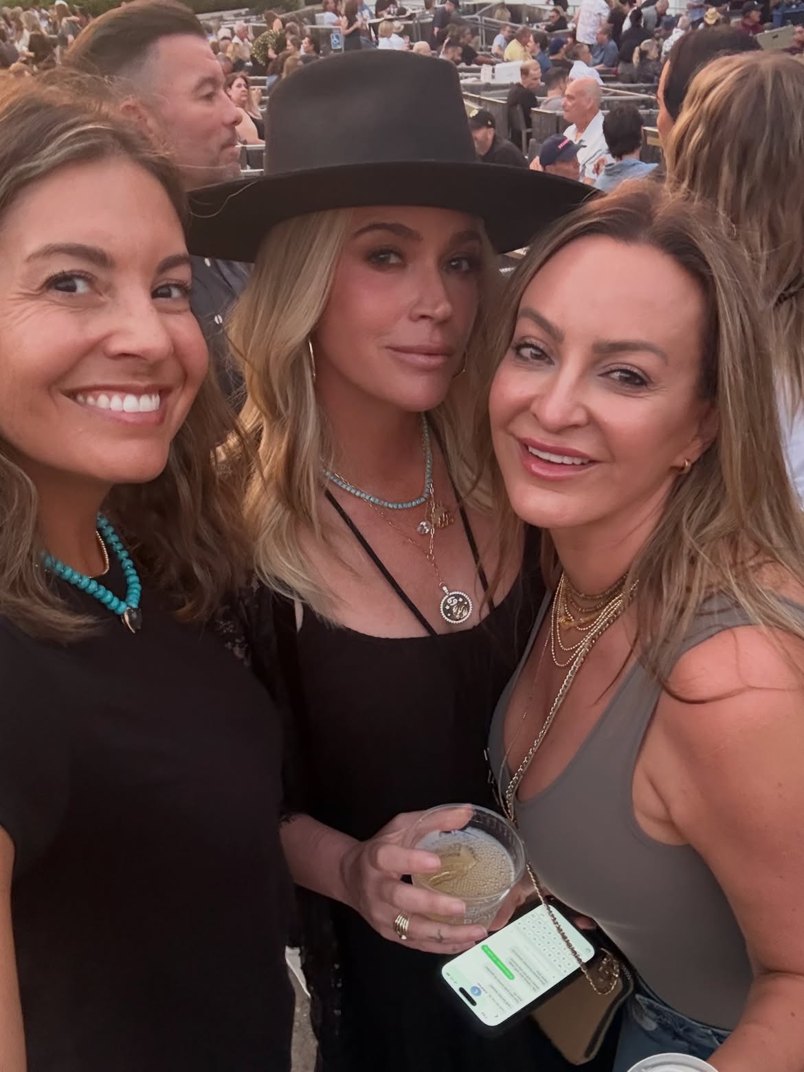 Teddi Mellencamp with two friends at her dad's concert.
