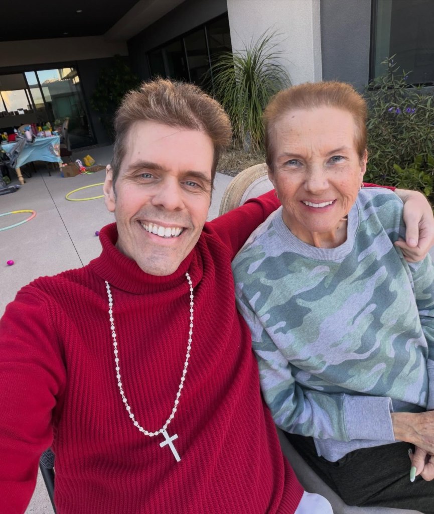 Perez Hilton and his mother smiling for a selfie.
