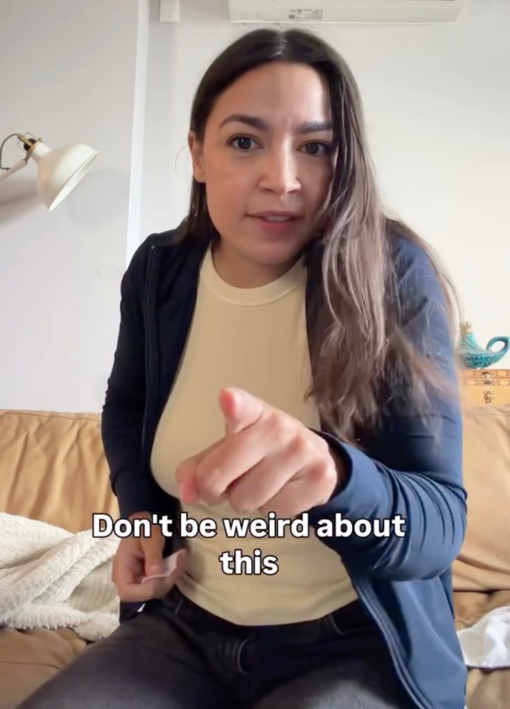 Alexandria Ocasio-Cortez pointing, with text overlay