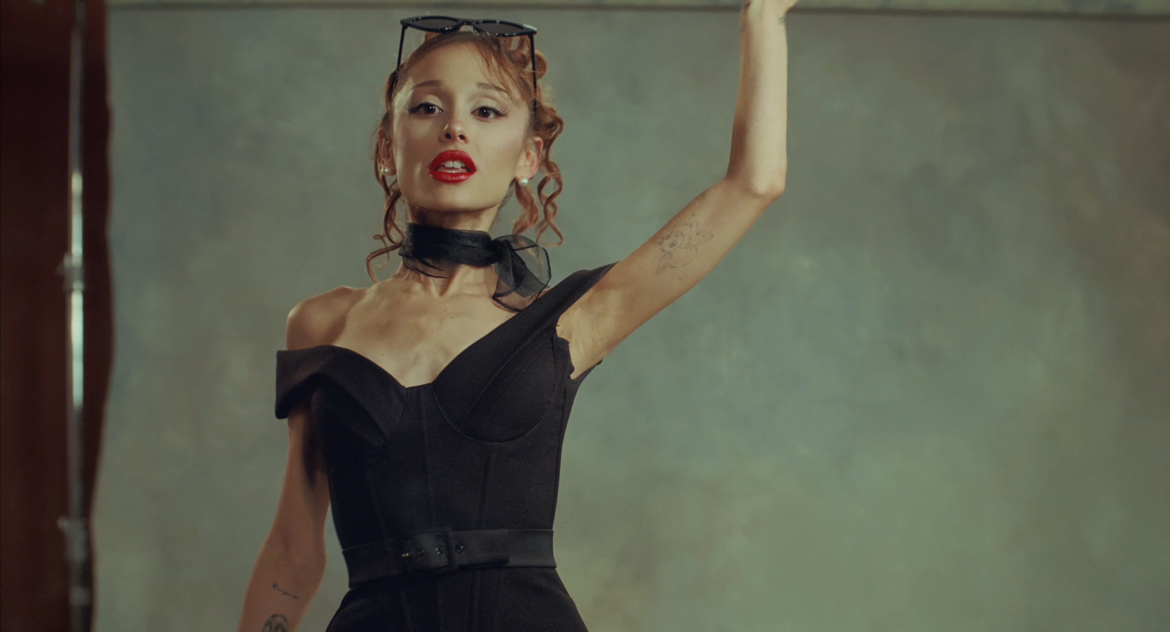 Ariana Grande in a retro "Grease"-style outfit.