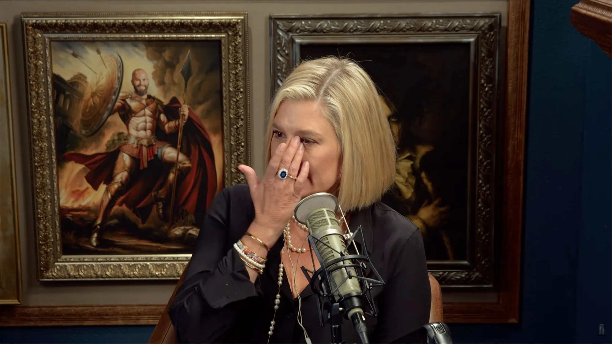 Christina Pazsitzky crying and rubbing her eyes.