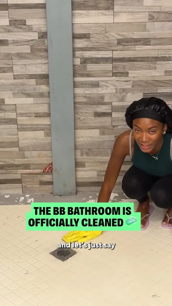 Big Brother Taylor cleaning the shower.