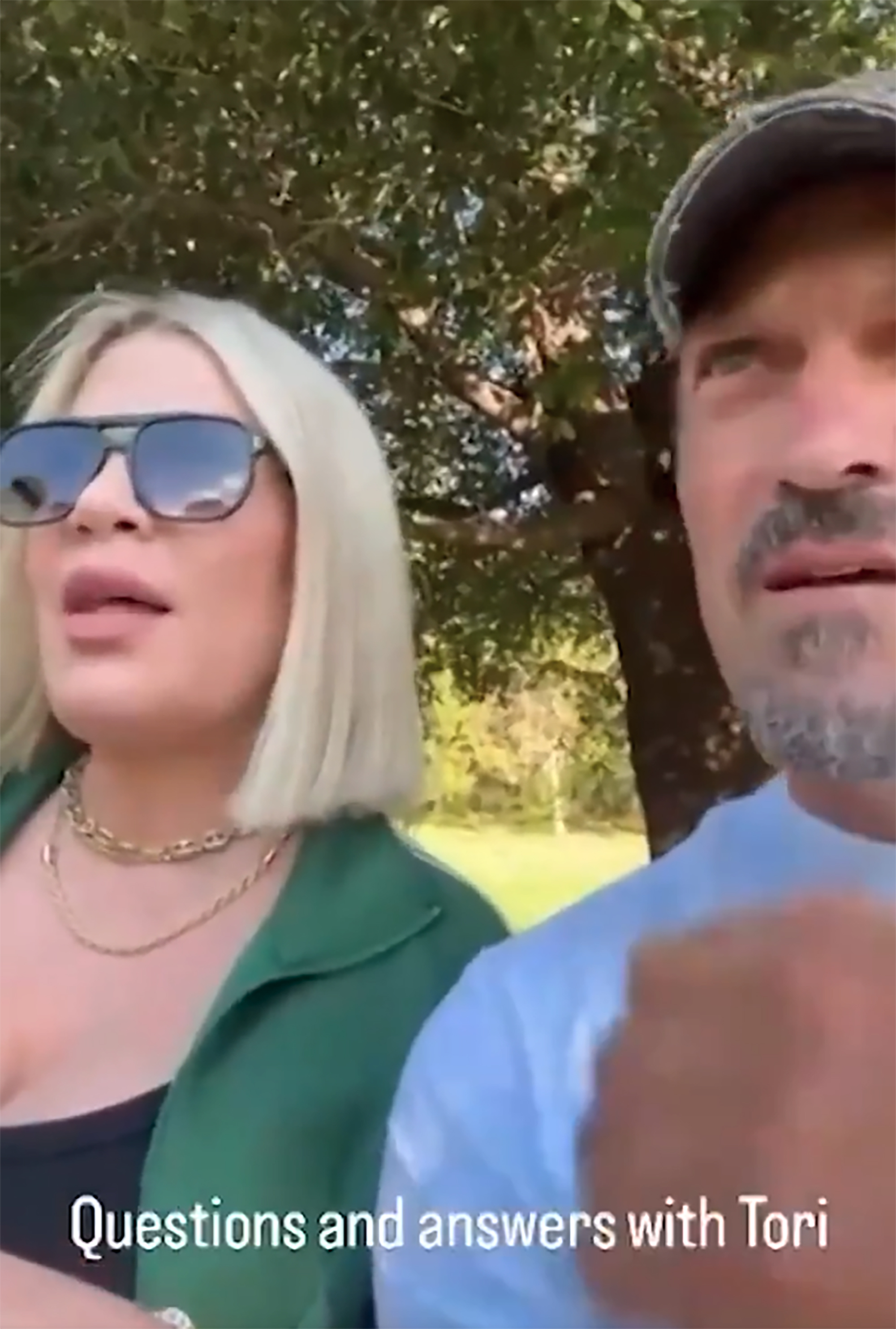 Tori Spelling and Brian Austin Green on Instagram Live answering questions.