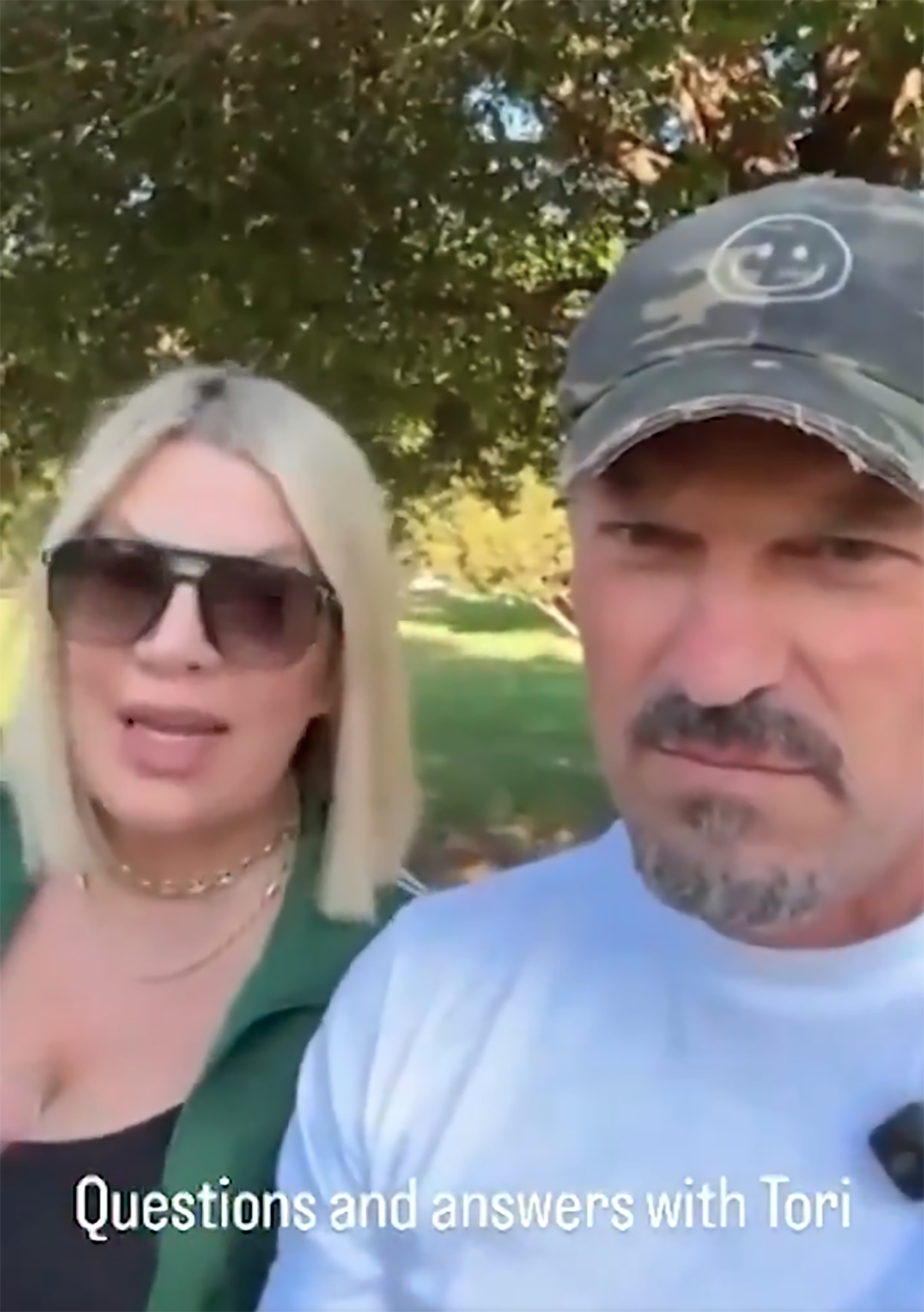 Tori Spelling and Brian Austin Green on Instagram Live answering questions.
